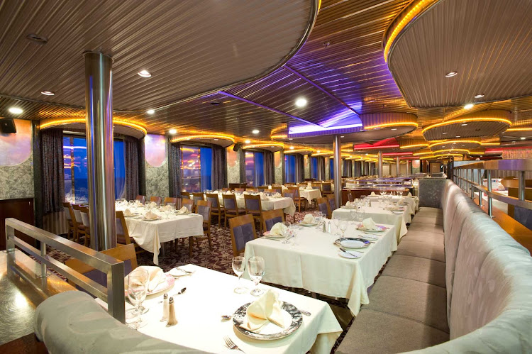 You'll have beautiful ocean views and fine meals at the Spirit dining room, one of Carnival Imagination's main dining halls.