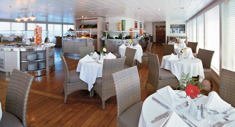 At mid-ship, Veranda provides indoor and outdoor dining for breakfast and lunch aboard Windstar Cruises' Wind Surf.