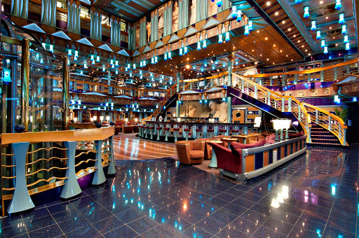 Meet new friends over cocktails in Carnival Miracle's vibrant atrium.