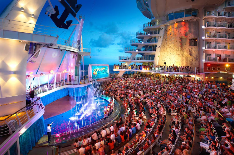 By day, the Aqua Theater aboard Oasis of the Seas is a pool and lounge area. At night it turns into a theatrical venue offering eye-popping water shows and acrobatic performances with seating for 600.