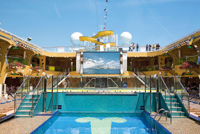 The large outdoor LED screen above Lido Sole, one of the pool areas on deck 9 of Costa Serena, shows movies, sporting events and concerts.