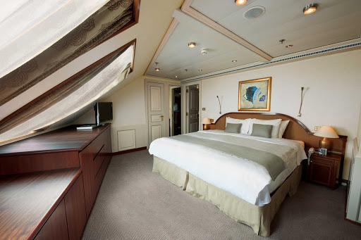 Silversea_Grand_Suite_3-1 - The Grand Suite aboard Silver Shadow has a spacious bedroom that features a queen size bed (or twin beds), sitting area and vanity table with hair dryer.