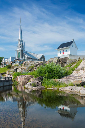 Saguenay-church-Quebec - The Sacre-Coeur church and century-old Little White House in Saguenay, a town on Quebec's Saguenay River, about 125 miles north of Quebec City.