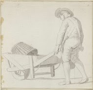 Man kruit kruiwagen met een mand erin