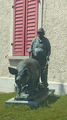 Bauer und seine Schweinetruppe