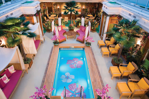Norwegian-Jade-Haven-courtyard - The exclusive Courtyard area on Norwegian Jade provides a restful oasis, with its inviting pool, comfy chairs, daybeds and nature-inspired accents.