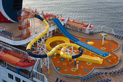 Thrillseekers of all ages can go deckside to ride the Twister waterslide and twin racing slides at WaterWorks, Carnival Sensation's aqua park.