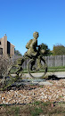 Boy Riding Bike Statue