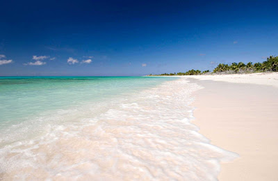 Cozumel, an island off the coast of Mexico, beckons with turquoise waters and wide sandy beaches.