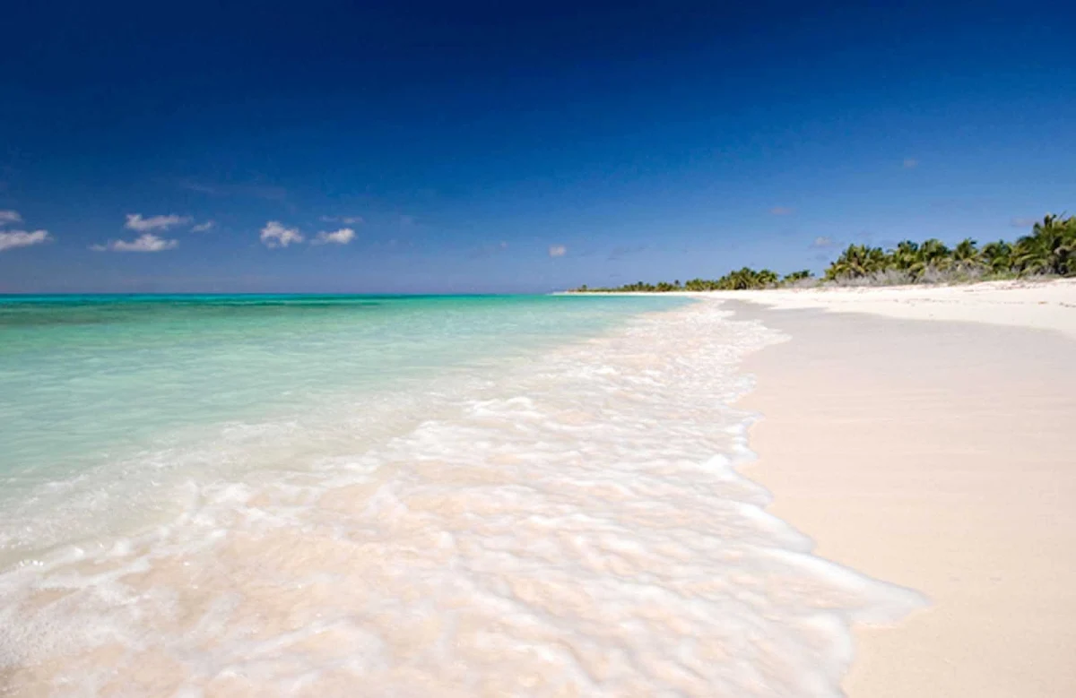 beach-island-Cozumel - Cozumel, an island off the coast of Mexico, beckons with turquoise waters and wide sandy beaches.