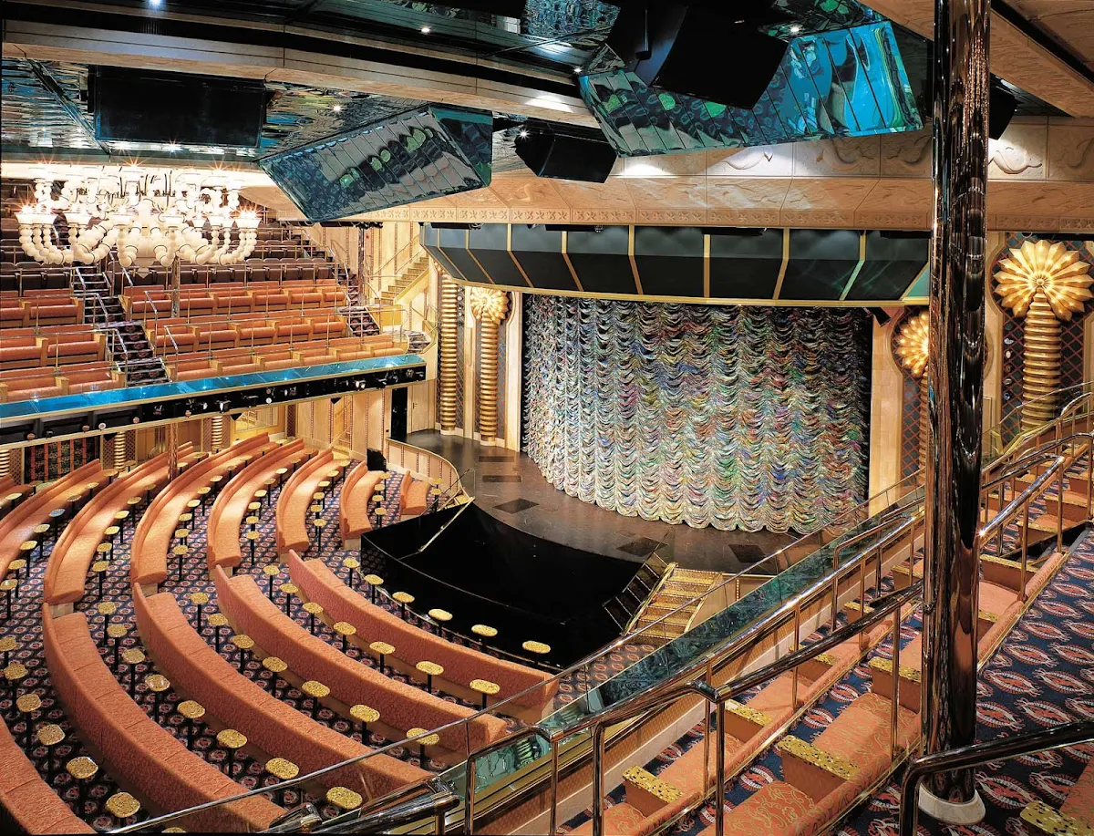 Carnival-Victory-Caribbean-Main-Lounge - The 1,400-seat Caribbean Lounge, Carnival Victory's main show theater, has a revolving stage, laser lights, retractable orchestra pit and other state-of-the-art features.