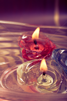 floating burning candles by Thinkodd In -  
