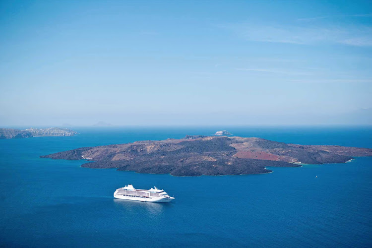 Embark on a Seven Seas Mariner cruise and explore the blissful Greek islands. Here's a view from Fira, the capital of Santorini.