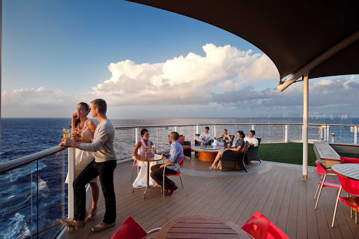 Take in the full sweep of the ocean at Sunset Bar on the top deck of Celebrity Solstice. 