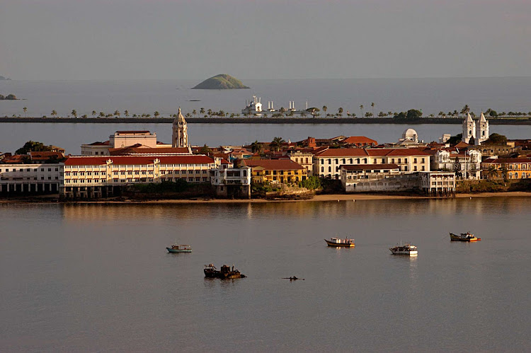  Colón, a seaport on the Atlantic coast of Panama, lies near the Caribbean Sea entrance to the Panama Canal. 