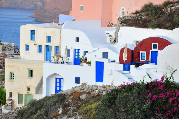 The town of Oia sports classic Mediterranean colors on the island of Santorini, Greece.