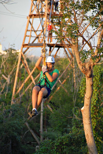 Cozumel-girl-ziplining - Take an adrenaline-pumping zipline ride on Cozumel, Mexico.