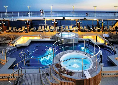 Oceania Nautica's large heated pool and whirlpool spas are the ideal location to unwind and enjoy your travels.