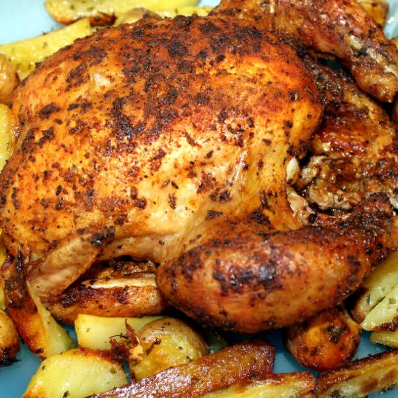 Roast Chicken  behind Roast Potatoes