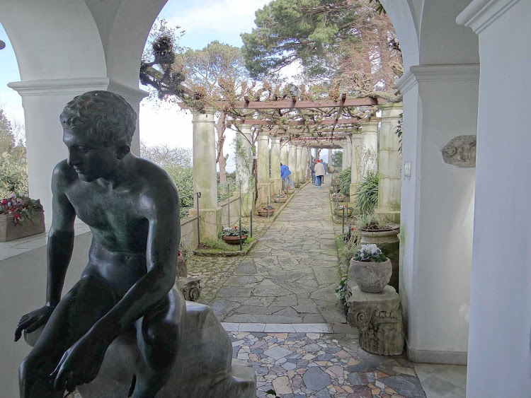 A garden path and statue on the island of Capri, Italy.