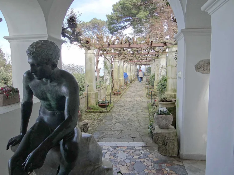 A garden path and statue on the island of Capri, Italy.
