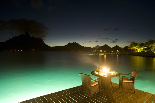 Dinner-Overwater-Balcony-BoraBora - Bora Bora restaurants feature decks over the water. Perfect for evening dining.