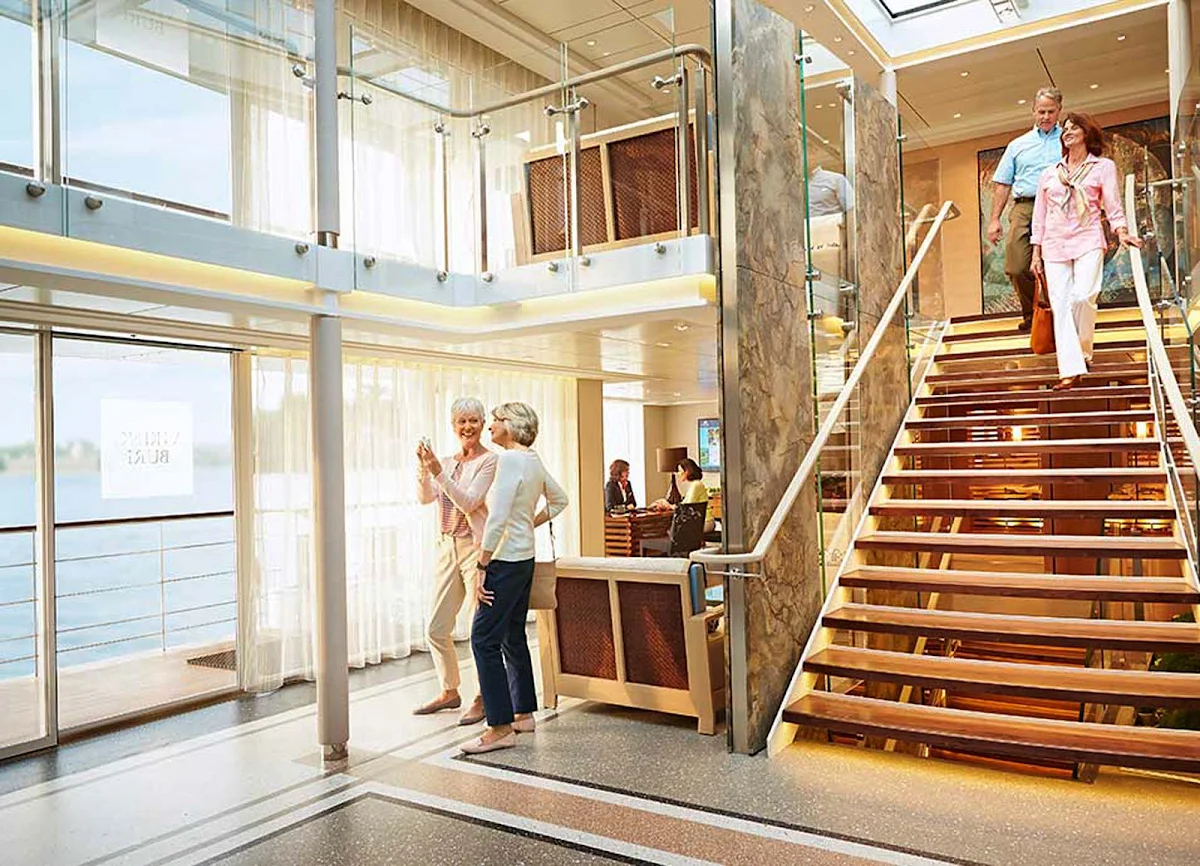 Viking-Longship-Atrium - Guests will gather in the spacious atrium before heading off on a daylong shore excursion during a typical Viking Cruises itinerary. 