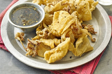 Salt & pepper squid with roast chilli dressing
