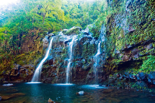 A tall waterfall along the coast of Maui. 