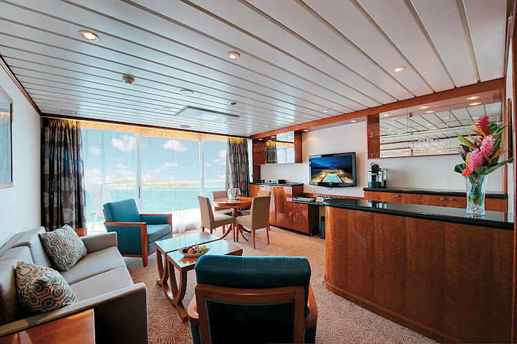 Owner's Suite 7002 on the Paul Gauguin features butler service and can accommodate up to four guests by adding two berths with a queen-size sofa bed. The bathroom includes a full-size tub and dressing area.