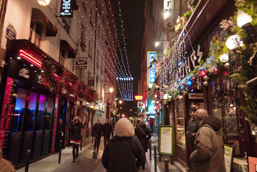 A bustling street in the Latin Quarter of Paris.