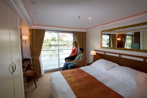 Settle back and take in the sights from your own stateroom during your AmaCello river cruise. 