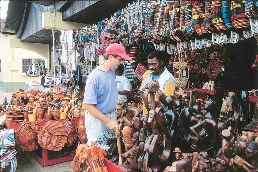 Shopping-Aruba - Shopping for textiles and bargains at a marketplace on Aruba.