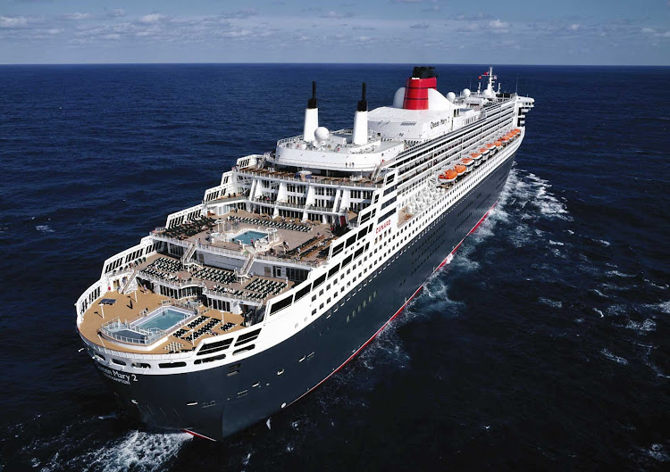 The aft of Queen Mary 2. The ship offers passengers five swimming pools and a large polished wood deck for lying in the sun or taking a stroll.