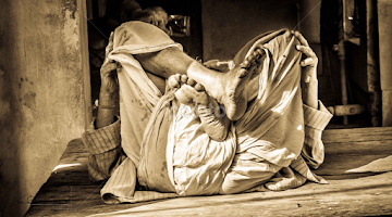 A PRIEST RESTING  by Chandan Lall -  