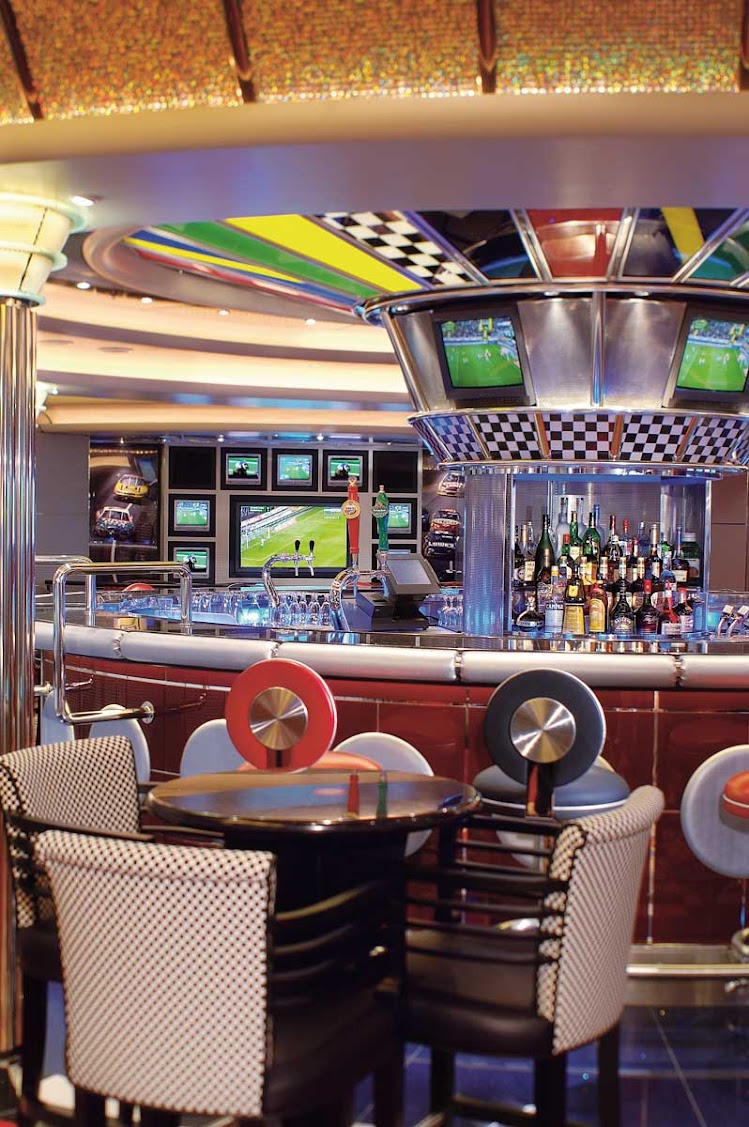 Grab a drink or snack, watch your choice of sports on TV, and relax at the Nascar-themed Pit Stop Sports Bar aboard Jewel of the Seas.