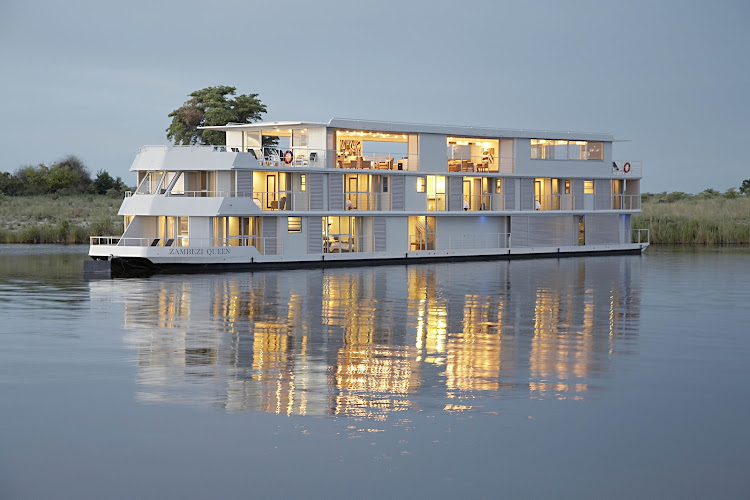 The Zambezi Queen offers a luxurious river safari on the Chobe River where Zimbabwe, Zambia, Botswana and Namibia all meet.