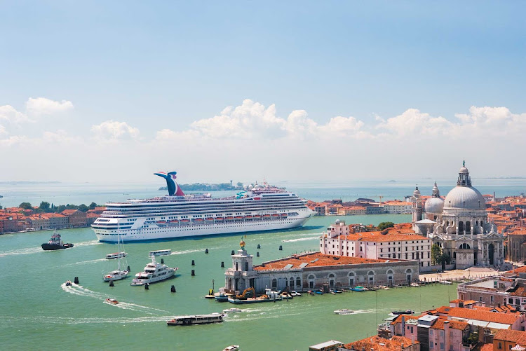 Carnival Freedom in Venice, Italy. The ship now cruises to the Caribbean, including the Caymans, Aruba, Curacao, Belize and the Bahamas. 