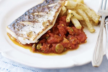 Pan-fried sea bass with puttanesca sauce & celeriac chips