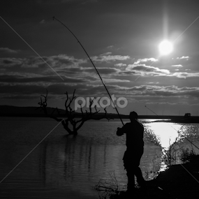 Fish to survive by António Lopes - Black & White Portraits & People