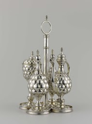 Houder van specerijenservies in de vorm van een blad met afschroefbaar handvat