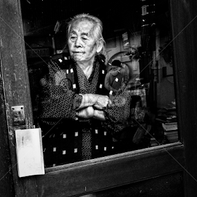 Shopkeeper by Kurt K Gledhill - City,  Street & Park Street Scenes