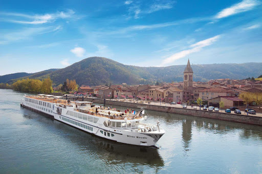 Uniworld-River-Royale-in-France - S.S. Bon Voyage (formerly River Royale), one of Uniworld's most luxurious cruise ships, sails through a historic villa in the south of France.