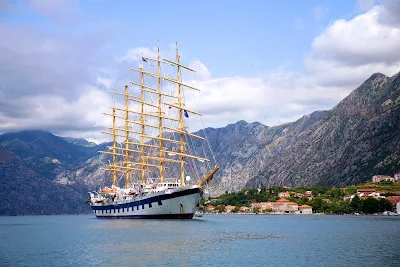Royal Clipper arrives in Kotor, Montenegro, as part of a Mediterranean itinerary.  The ship carries just 227 guests and boasts 19,000 square feet of open deck and three swimming pools.