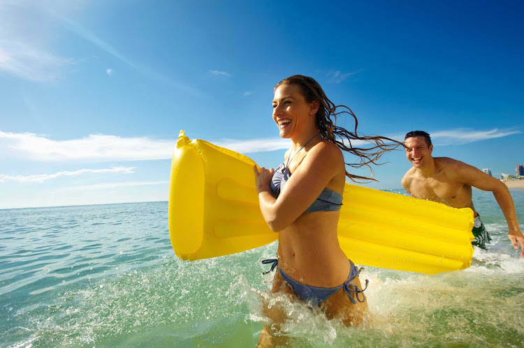 Fun along the beach during a shore excursion in the tropics on a Royal Caribbean cruise.