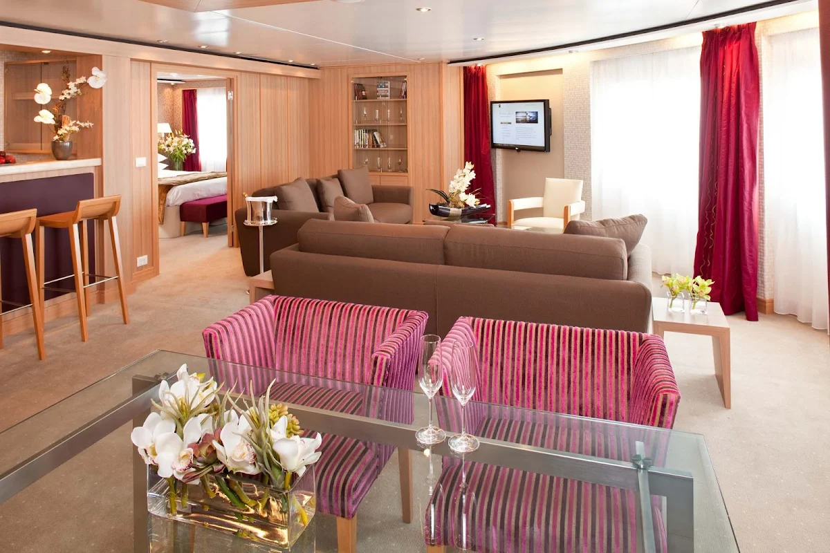Seabourn_Odyssey_Sojourn_Quest_Signature_Suite-4 - The Signature Suite on Seabourn Odyssey lets you spread out. It has a dining area that fits six people, a private bedroom and bathroom with a large whirlpool tub, a stocked pantry and wet bar, and complimentary wi-fi.