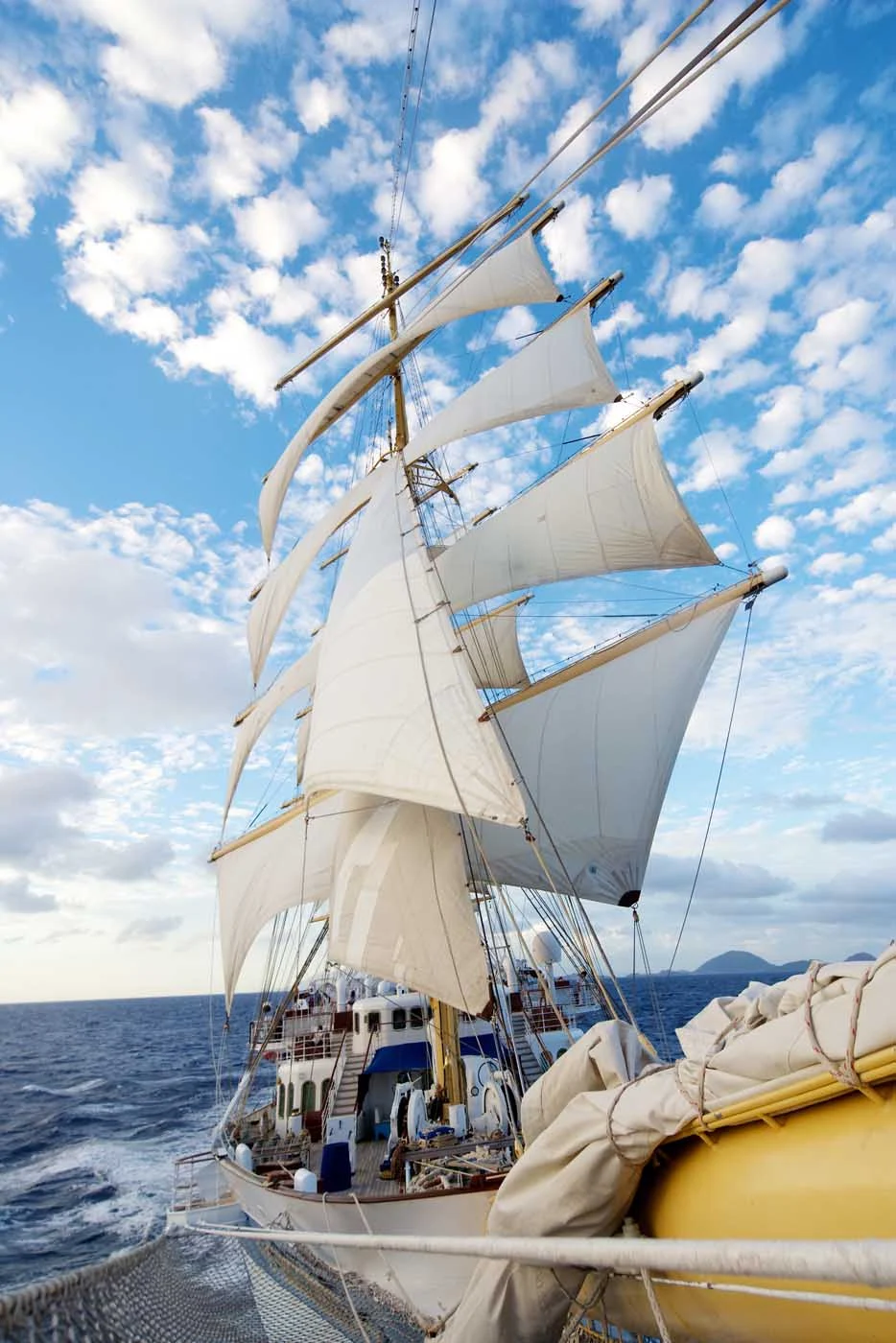 Royal-Clipper-sails - Feel the wind fill the sails of Royal Clipper. The ship has five masts that fly 42 lovely sails with a sail area of 56,000 square feet.