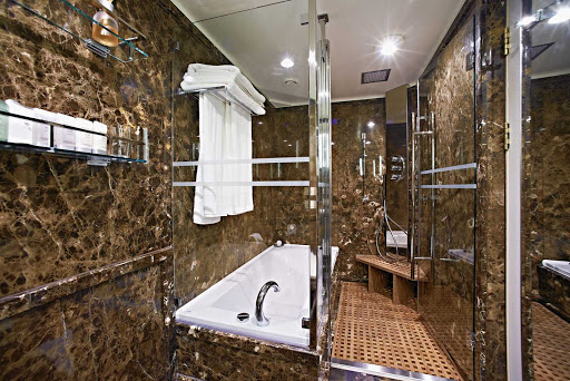 A full-size tub and separate shower are standard in the marble bathroom of Silver Cloud's Grand Suite.