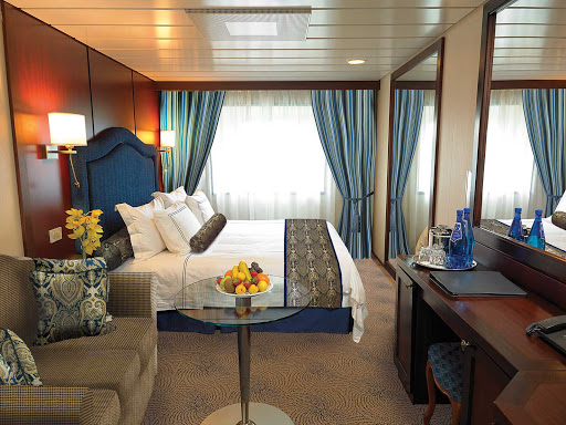 The C Level Deluxe Ocean View staterooms on Oceania Insignia contain custom-designed furnishings, queen or two twin bed accommodations, spacious seating area, vanity desk and breakfast table. At 165 square feet, they're located on decks 4,6 and 7.   