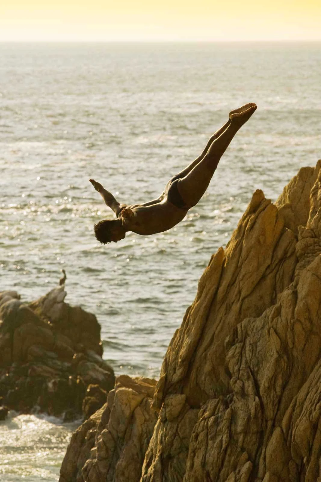 Acapulco-cliff-diver - One of the famed cliff divers (La Quebrada) of Acapulco.